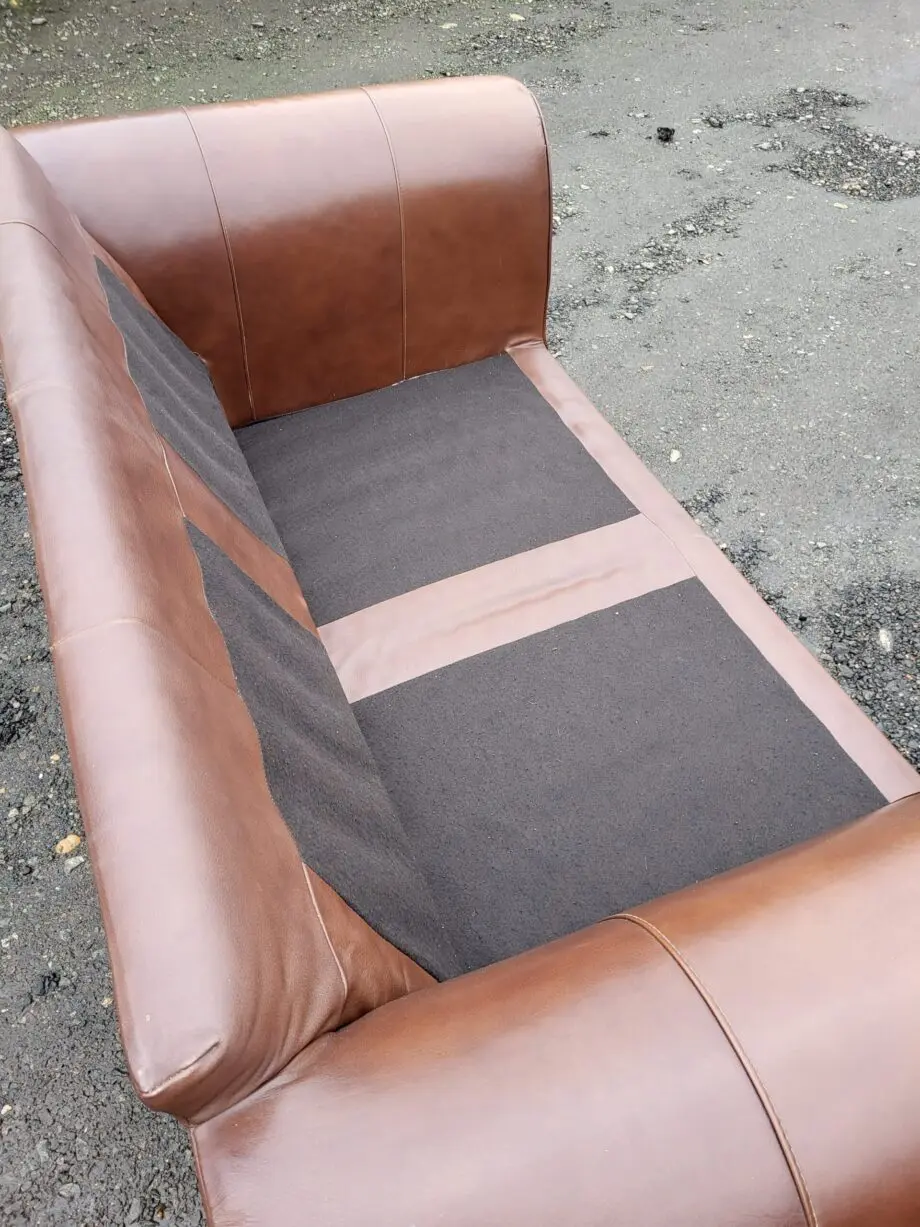 Two Brown Two-Seater Sofas & Footstool