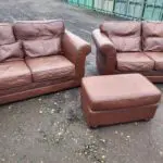 Two Brown Two-Seater Sofas & Footstool