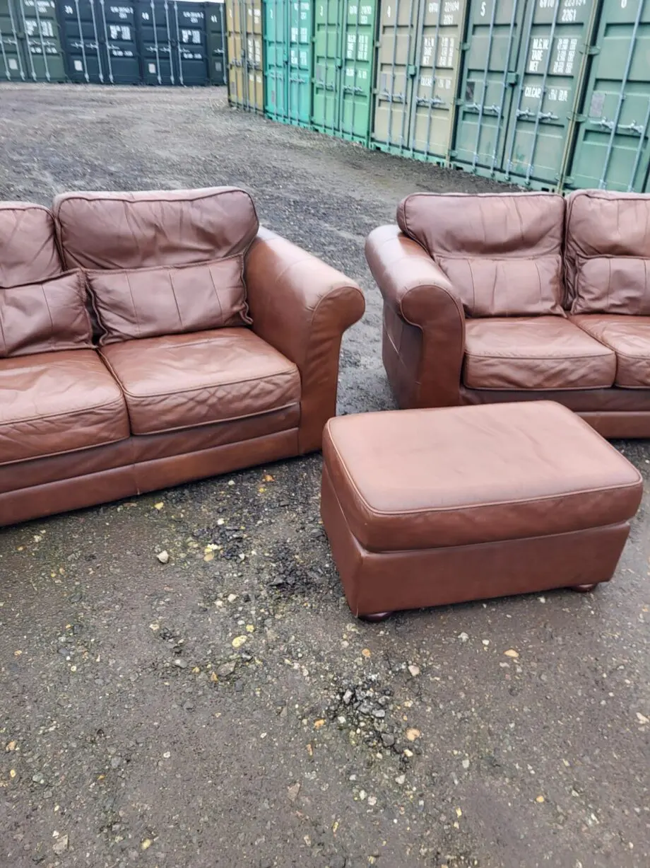Two Brown Two-Seater Sofas & Footstool