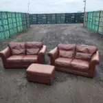 Two Brown Two-Seater Sofas & Footstool