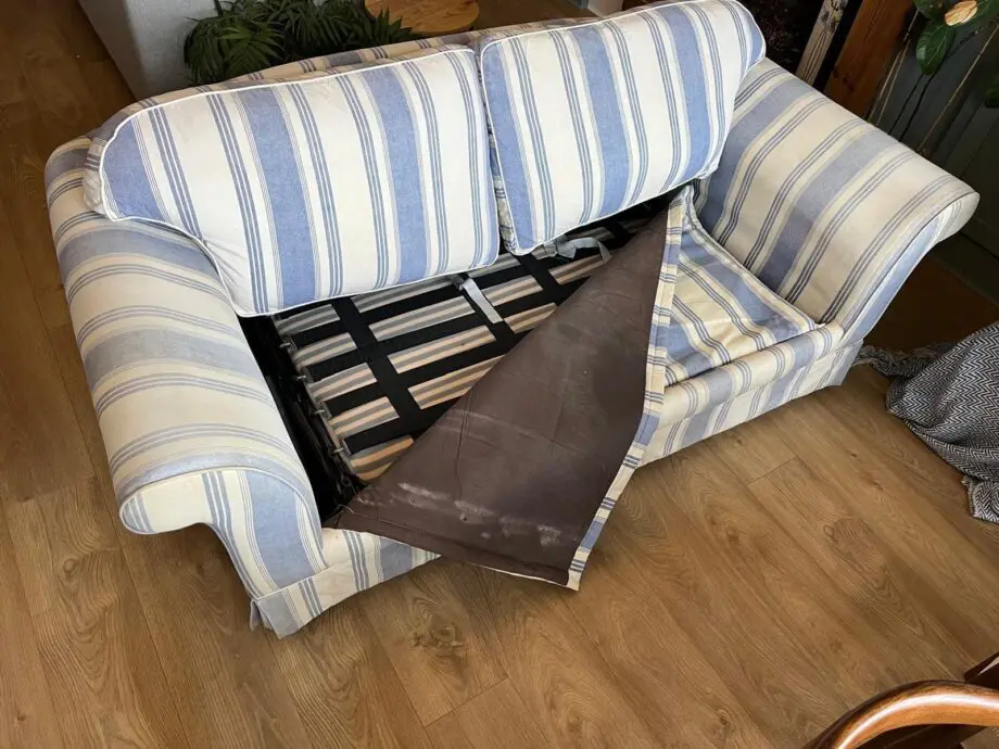 Laura Ashley blue and cream striped sofa bed