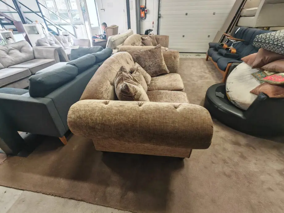 Beige/brown chesterfield sofas.