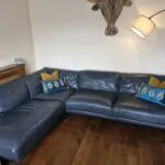 DFS navy leather corner sofa and chair
