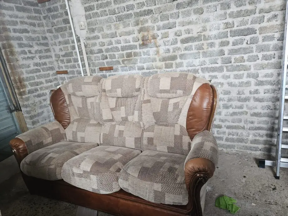 Beige and brown leather patch sofa