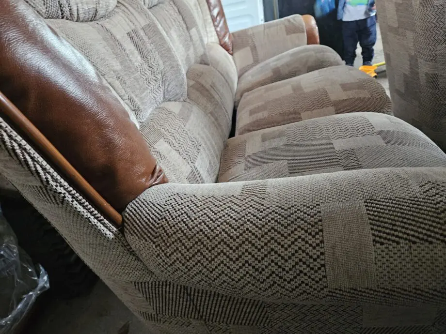 Beige and brown leather patch sofa
