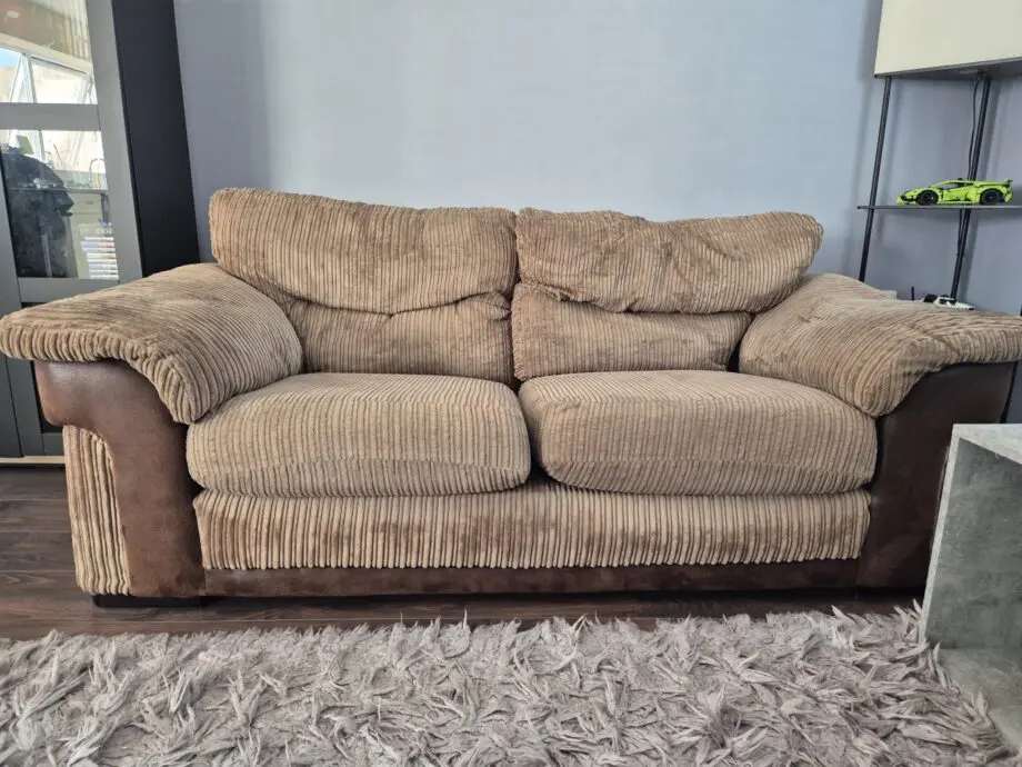 Brown two seater sofa