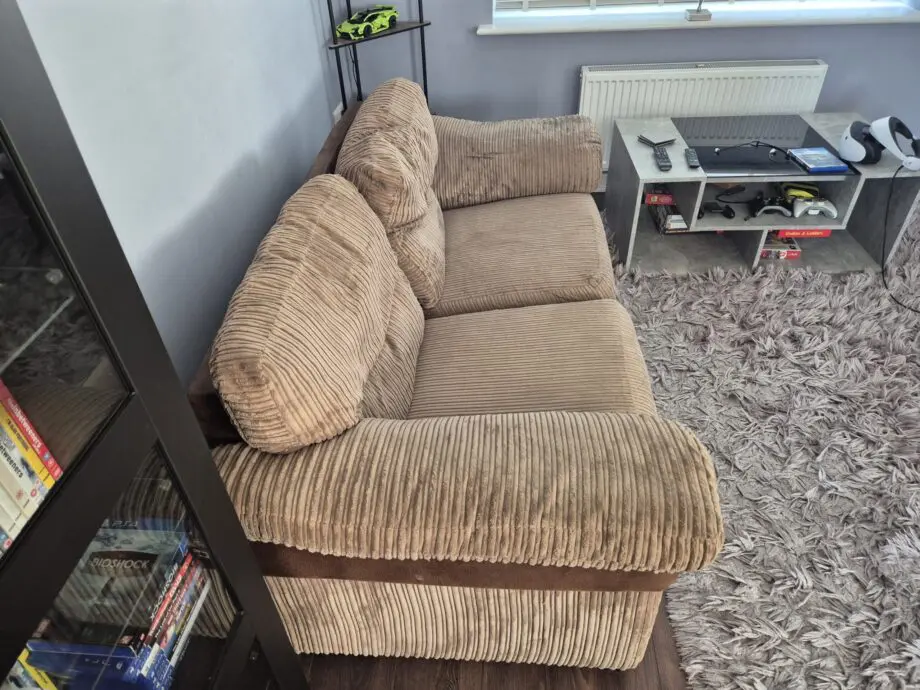 Brown two seater sofa