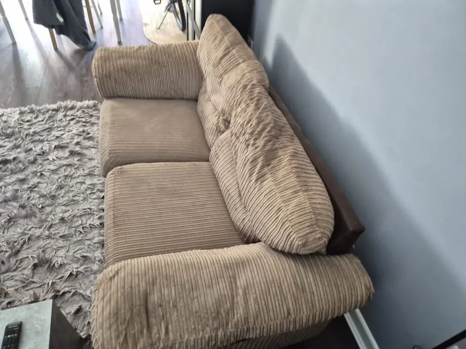 Brown two seater sofa
