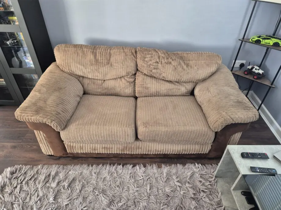 Brown two seater sofa