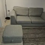 3 seater mint green DFS sofa with matching ottoman footstool