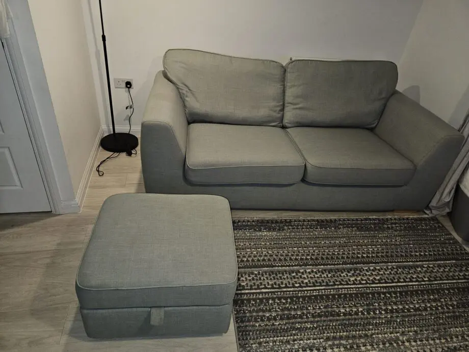3 seater mint green DFS sofa with matching ottoman footstool