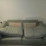 3 seater mint green DFS sofa with matching ottoman footstool