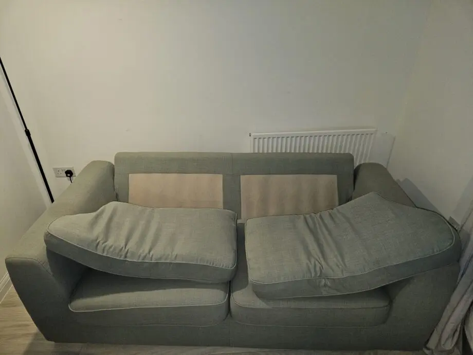 3 seater mint green DFS sofa with matching ottoman footstool