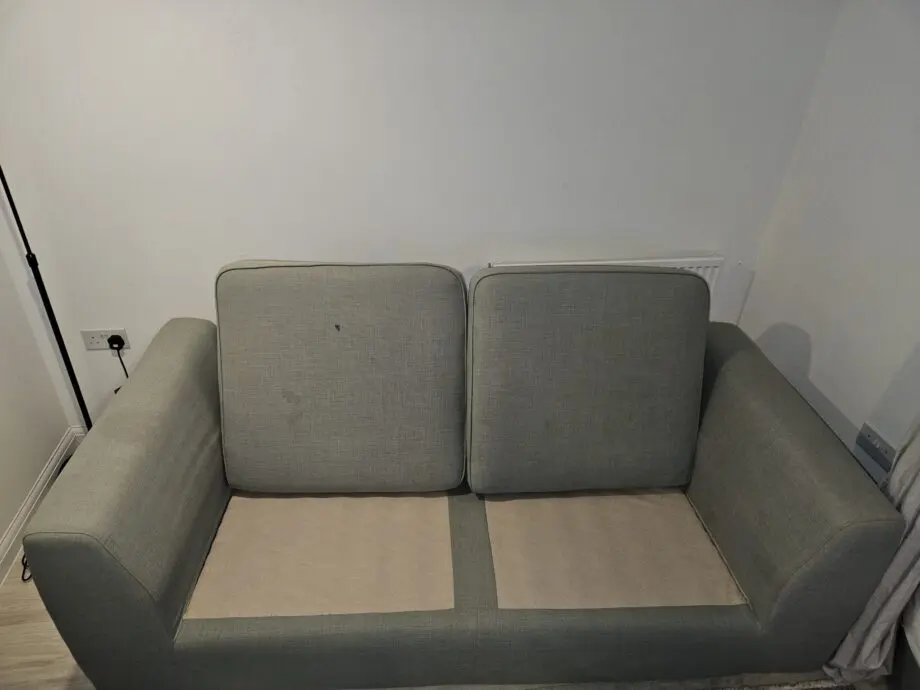 3 seater mint green DFS sofa with matching ottoman footstool