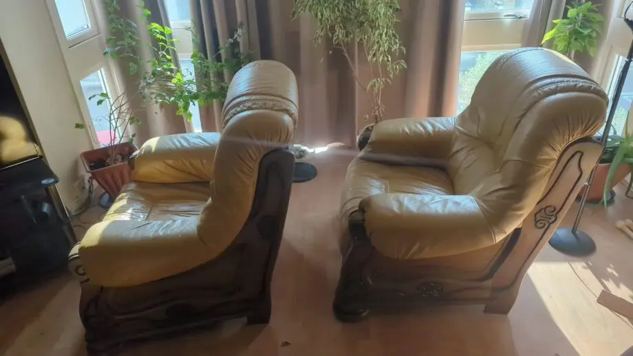 2 solid oak leather armchairs with