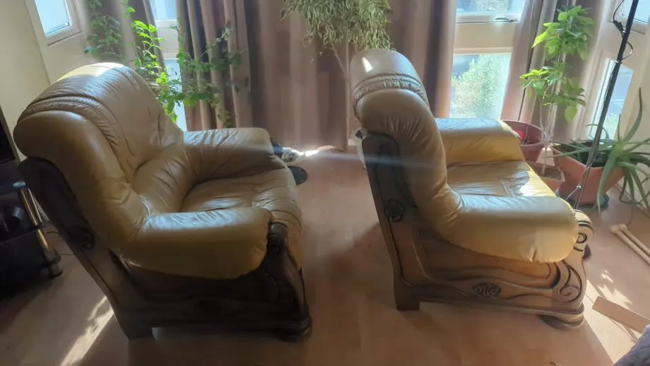 2 solid oak leather armchairs with