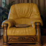 2 solid oak leather armchairs with