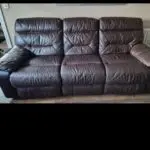 DFS Dark brown leather sofa double recliner