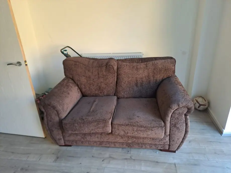 Two seater sofa brown colour