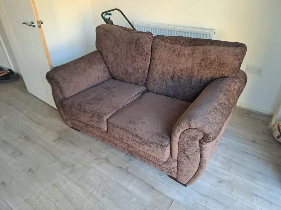 Two seater sofa brown colour