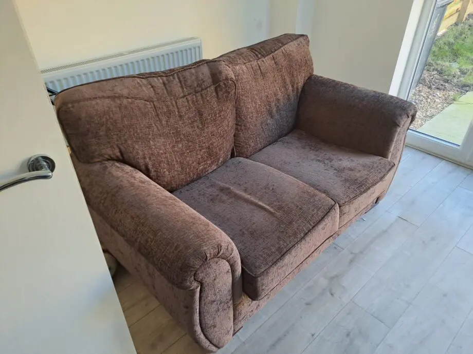 Two seater sofa brown colour
