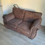 Two seater sofa brown colour