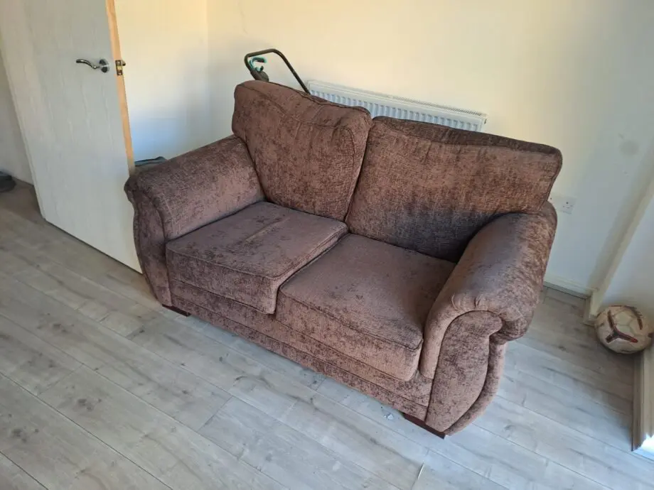 Two seater sofa brown colour