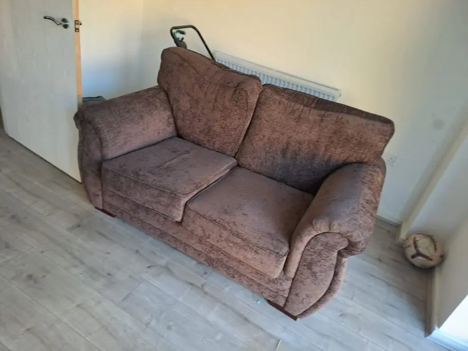 Two seater sofa brown colour