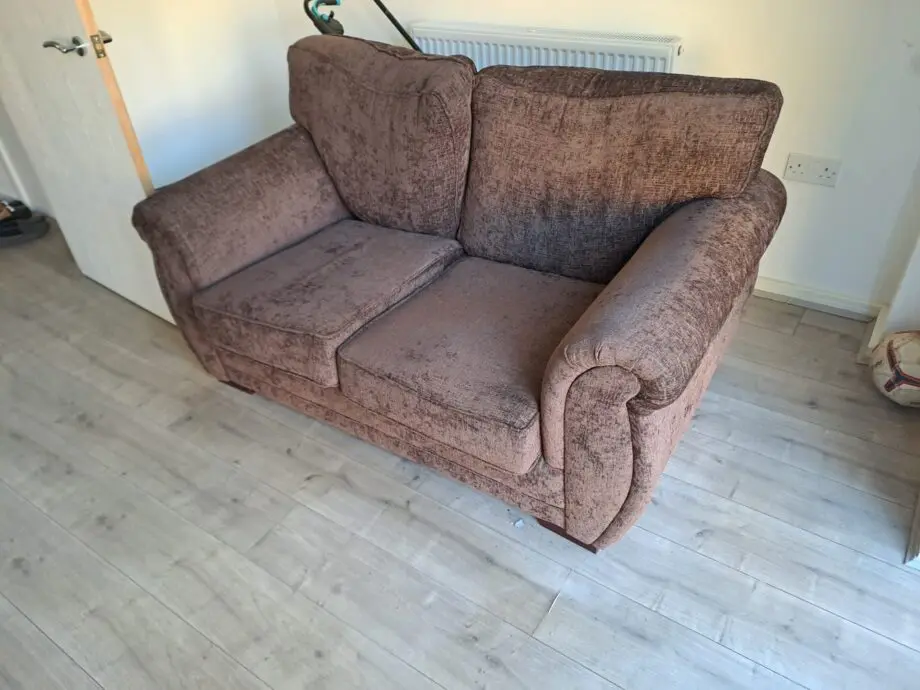 Two seater sofa brown colour
