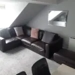 brown leather corner sofa and matching storage footstool ottoman