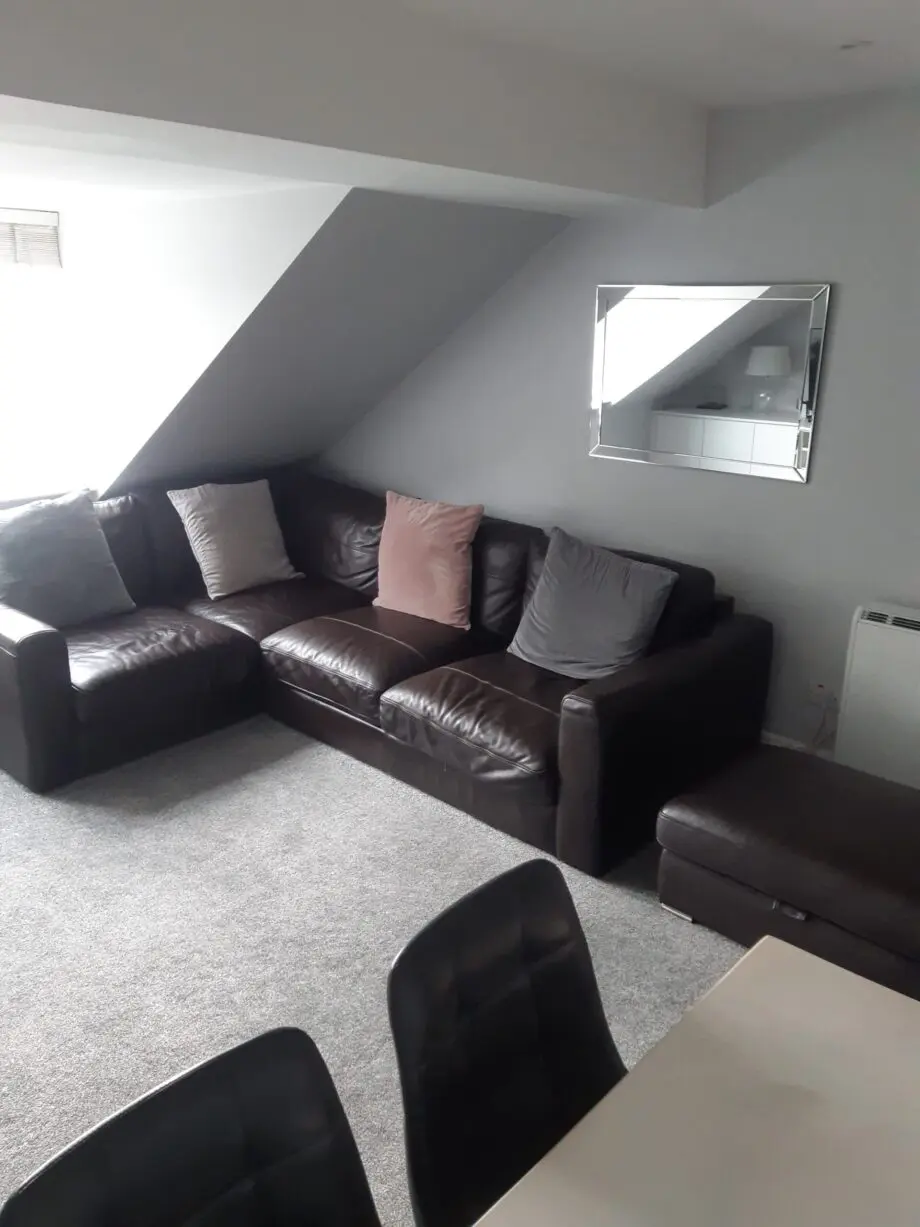 brown leather corner sofa and matching storage footstool ottoman