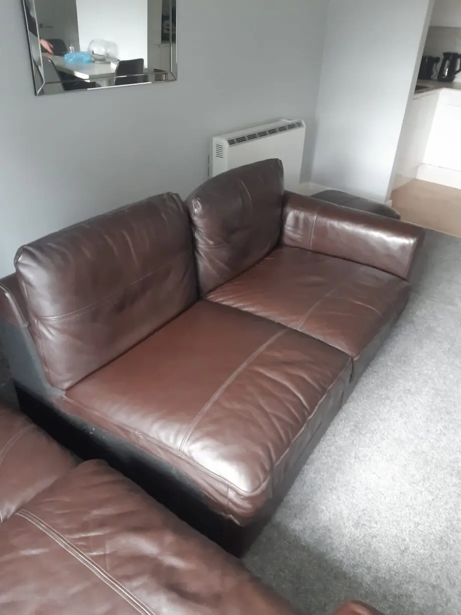 brown leather corner sofa and matching storage footstool ottoman