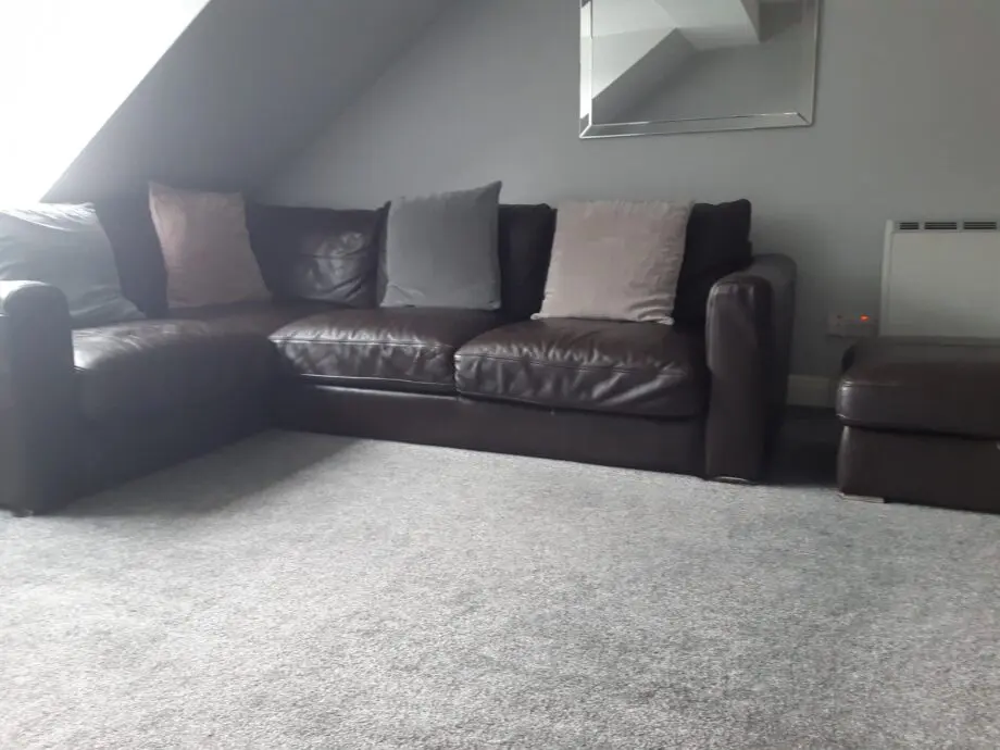 brown leather corner sofa and matching storage footstool ottoman