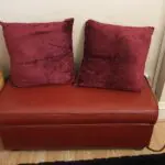 Red 3 seater leather sofa in good state