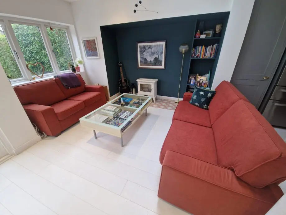 Two lovely matching comfy rust/orange sofas