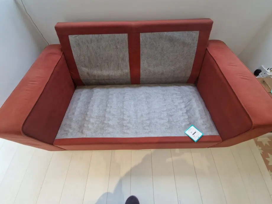 Two lovely matching comfy rust/orange sofas