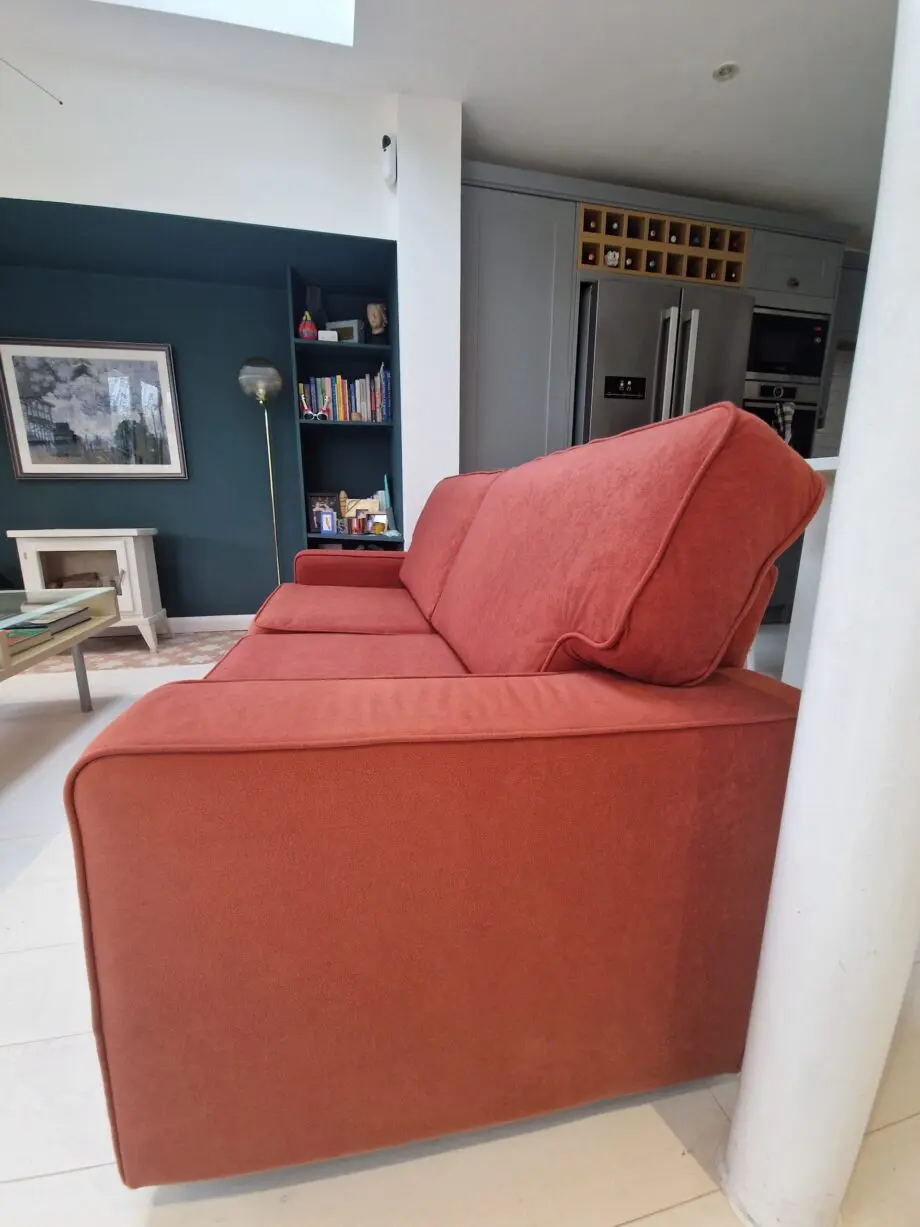 Two lovely matching comfy rust/orange sofas