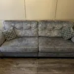 Paisley grey studded sofas and Banquet foot stall