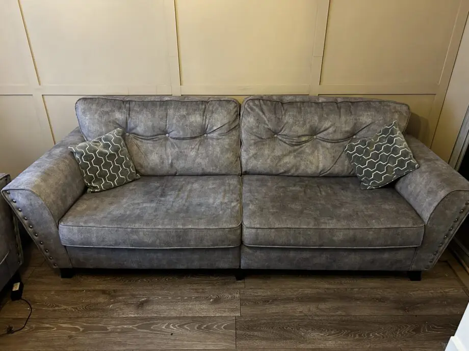 Paisley grey studded sofas and Banquet foot stall