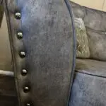 Paisley grey studded sofas and Banquet foot stall