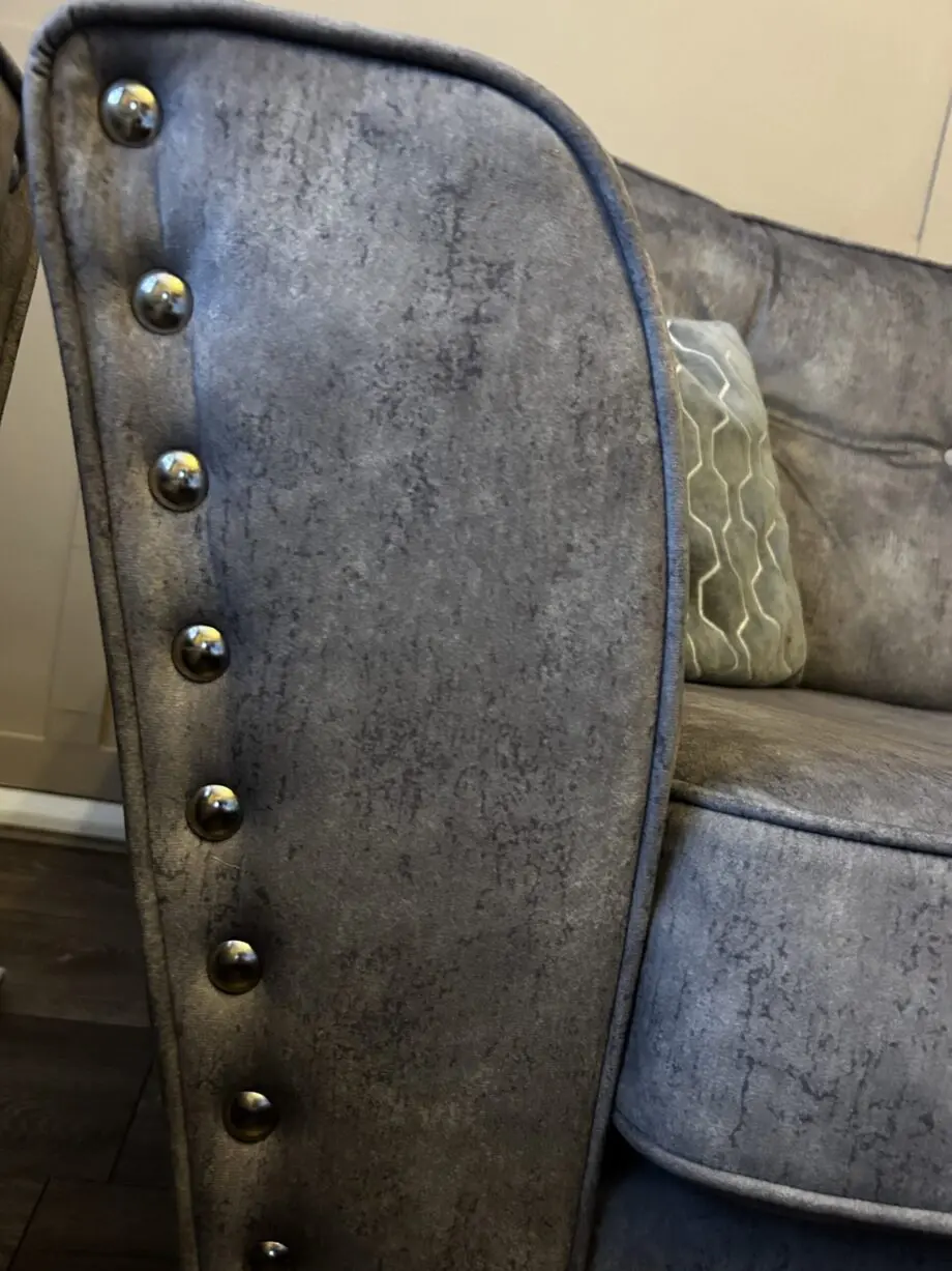Paisley grey studded sofas and Banquet foot stall