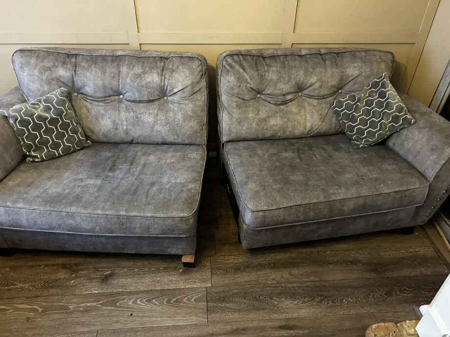 Paisley grey studded sofas and Banquet foot stall