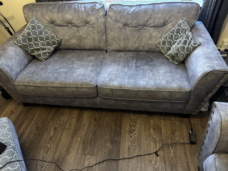 Paisley grey studded sofas and Banquet foot stall
