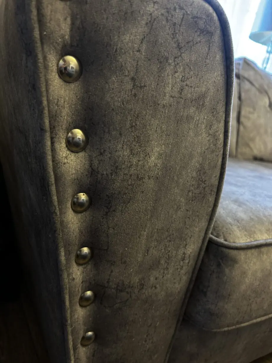 Paisley grey studded sofas and Banquet foot stall