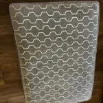Paisley grey studded sofas and Banquet foot stall