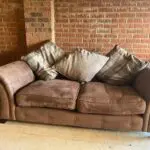 DFS brown 2 seater Pillow Back sofa with footstool