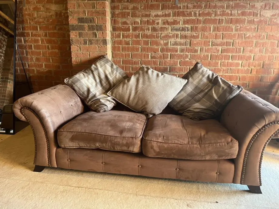 DFS brown 2 seater Pillow Back sofa with footstool