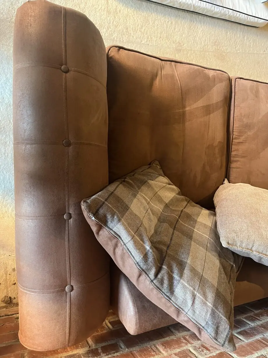 DFS brown 2 seater Pillow Back sofa with footstool