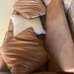 DFS brown 2 seater Pillow Back sofa with footstool