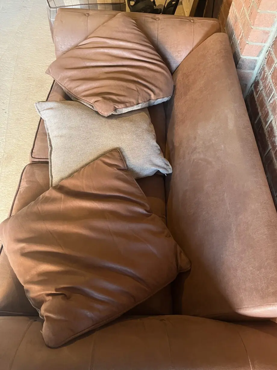 DFS brown 2 seater Pillow Back sofa with footstool